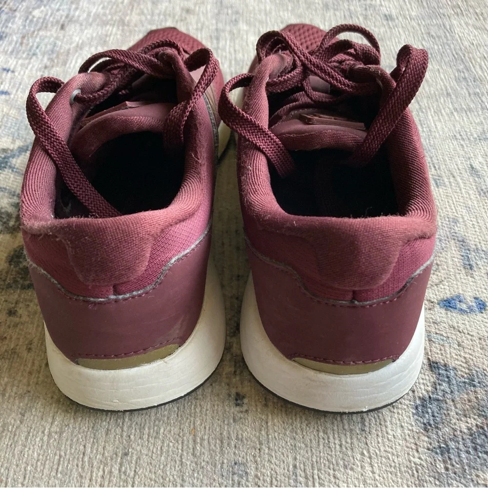 New Balance women’s Burgundy Sneakers with Gold Accent